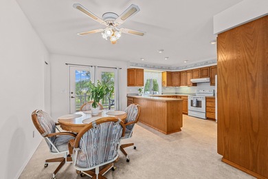 Sitting on the cov. deck, drinking a cup of coffee, watching the