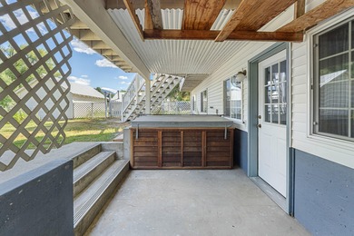 Sitting on the cov. deck, drinking a cup of coffee, watching the