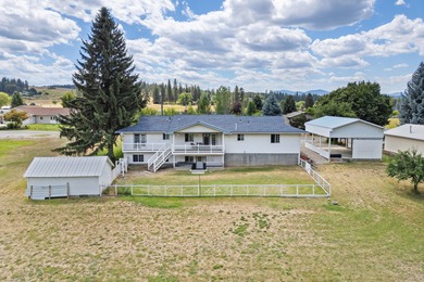 Sitting on the cov. deck, drinking a cup of coffee, watching the