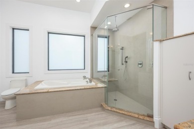 Set on a corner lot with over 200 feet of waterfront, this