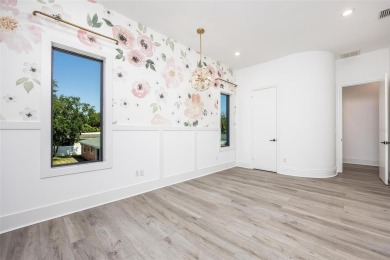 Set on a corner lot with over 200 feet of waterfront, this