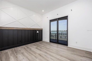 Set on a corner lot with over 200 feet of waterfront, this