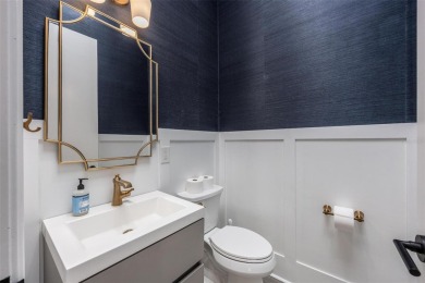 Set on a corner lot with over 200 feet of waterfront, this