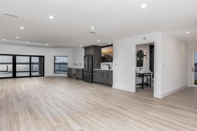 Set on a corner lot with over 200 feet of waterfront, this