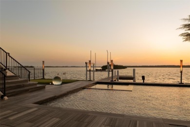 Set on a corner lot with over 200 feet of waterfront, this