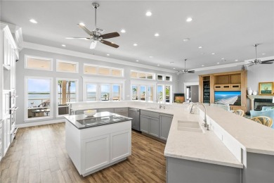 This extraordinary waterfront estate spans over 4,300 sq. ft. of