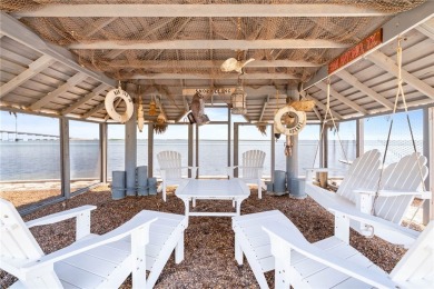 This extraordinary waterfront estate spans over 4,300 sq. ft. of