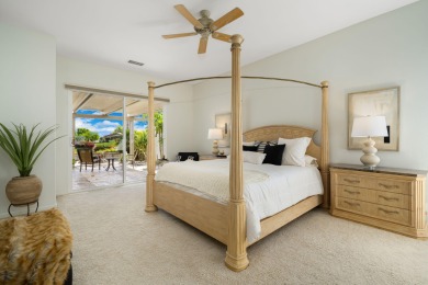 The beautifully relandscaped front yard with faux grass, exotic