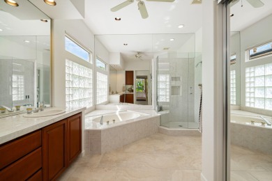 The beautifully relandscaped front yard with faux grass, exotic