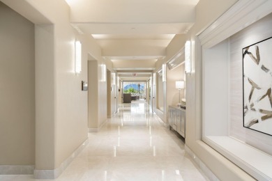 The beautifully relandscaped front yard with faux grass, exotic