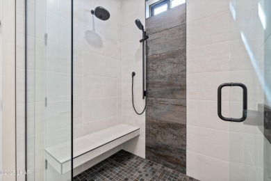 This stunning new construction contemporary home offers