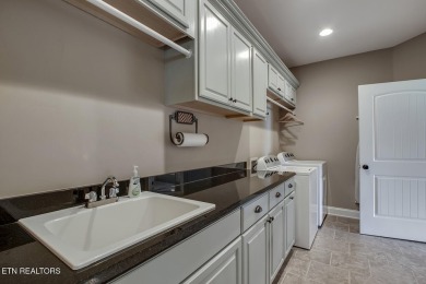 Experience refined living in this stunning 6,513 sq. ft