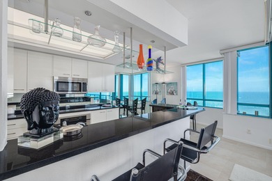 Experience elevated coastal living from this modern Gulf-front