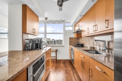 Penthouse G at Cloister Towers presents a rare opportunity to