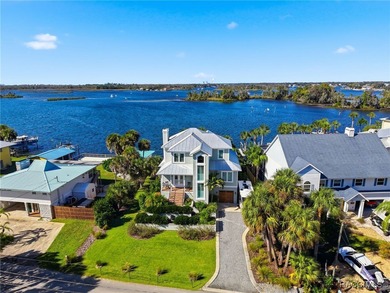 EXTREMELY RARE chance to own a stunning home RIGHT on King's Bay