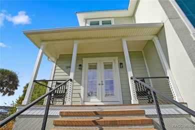 EXTREMELY RARE chance to own a stunning home RIGHT on King's Bay