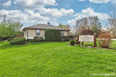 Currently used as a law office, 4 offices with 2 baths Vast