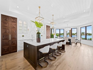 Live the true *South Florida Lifestyle* on this island's gated