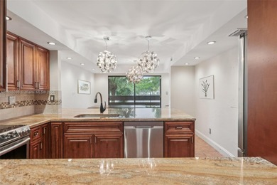 Welcome to this beautifully maintained two-story condo in