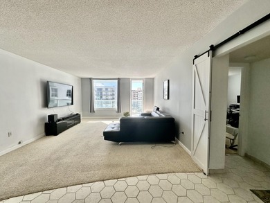 The oceanfront two-bedroom, two-bath residence combines a highly