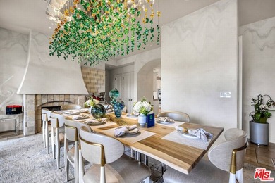 Perched atop a secluded, gated street off Benedict Canyon Drive