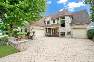 THIS LAKEFRONT EXQUISITE ESTATE IN PREMIER LAKELANDS CLUB