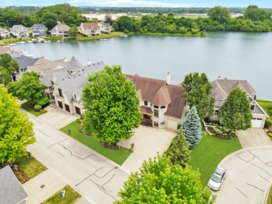 THIS LAKEFRONT EXQUISITE ESTATE IN PREMIER LAKELANDS CLUB