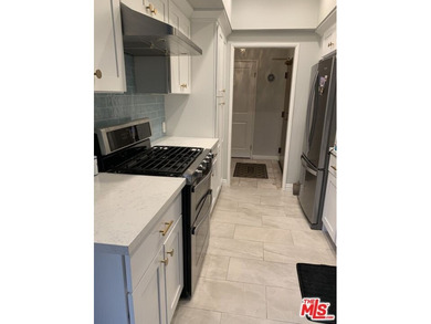 Beautiful, bright, remodeled one-bedroom, two-bath condo