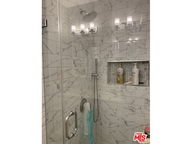 Beautiful, bright, remodeled one-bedroom, two-bath condo