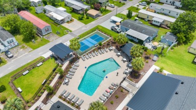 Welcome to Oceanside Landing, a highly sought-after 55+