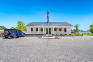 Welcome to Oceanside Landing, a highly sought-after 55+