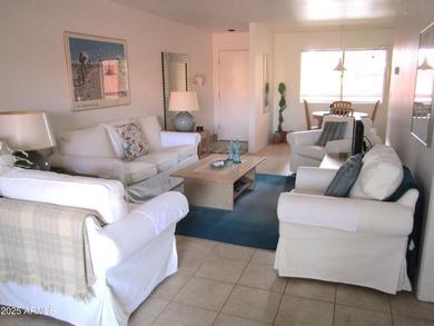 Step into this open and bright condo that blends warmth and