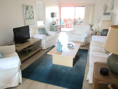 Step into this open and bright condo that blends warmth and