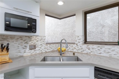 Located in the prestigious guard-gated Las Vegas Country Club