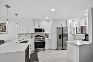 Completely renovated first-floor condo featuring 2 bedrooms and