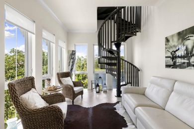 Welcome to one of the rare 201 coach homes in the coveted Isles