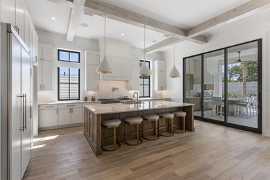 Experience refined coastal living in this newly built, fully