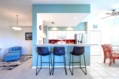 Panoramic West facing lake and fairway views abound in this