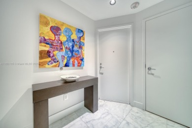 Experience breathtaking Biscayne Bay views from this 2 bed + den