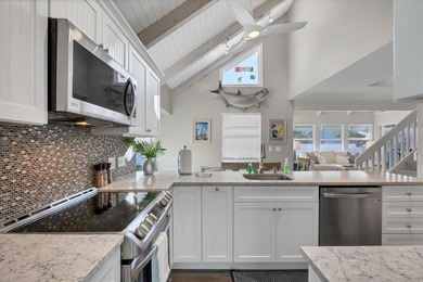 Steps from the pristine sand of the Gulf and one of three gulf