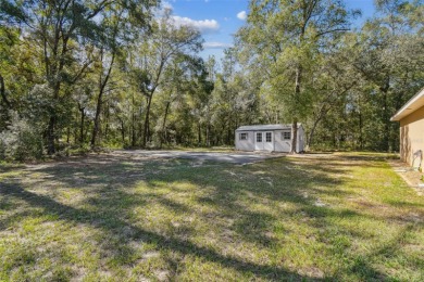 Tucked away on a VERY PRIVATE and SECLUDED .55-acre corner lot