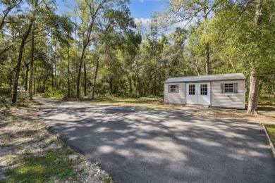 Tucked away on a VERY PRIVATE and SECLUDED .55-acre corner lot