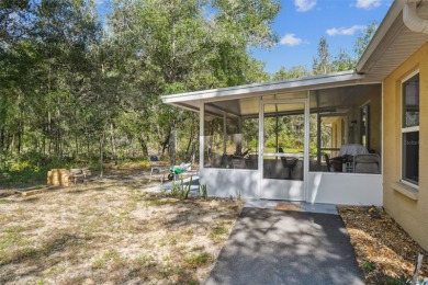 Tucked away on a VERY PRIVATE and SECLUDED .55-acre corner lot