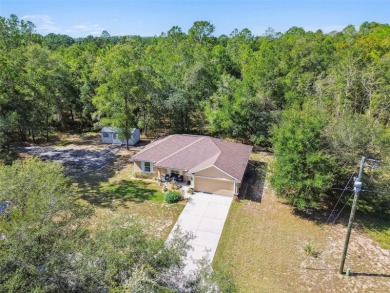 Tucked away on a VERY PRIVATE and SECLUDED .55-acre corner lot