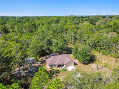 Tucked away on a VERY PRIVATE and SECLUDED .55-acre corner lot