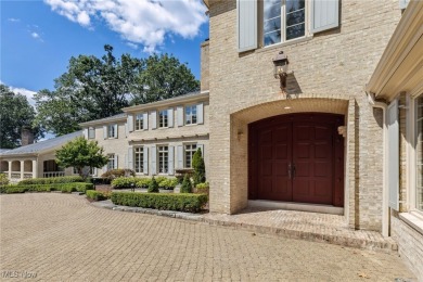 Behind a private gated entry, 400 Hunters Hollow unfolds across