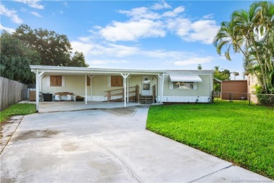 Charming mobile home on a cul-de-sac with a fenced yard and