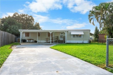 Charming mobile home on a cul-de-sac with a fenced yard and