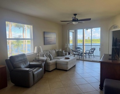 *FURNISHED END UNIT plus a DEN with WATER & GOLF COURSE VIEWS!