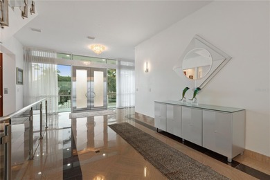 Located in the private, gated enclave of Esplanade on the Bay